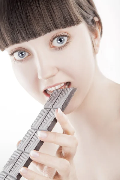 Beautiful young woman with big chocolate bar (Series) — Stock Photo, Image