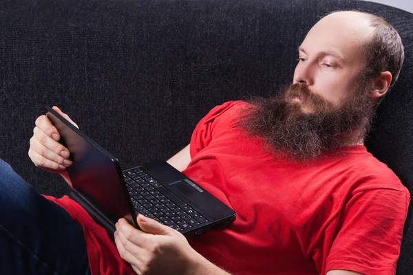 A man on the sofa is reading - (Series) — Stock Photo, Image