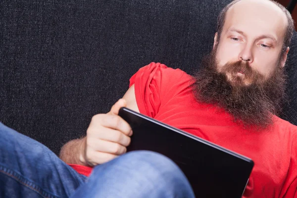 A man on the sofa is reading - (Series) — Stock Photo, Image