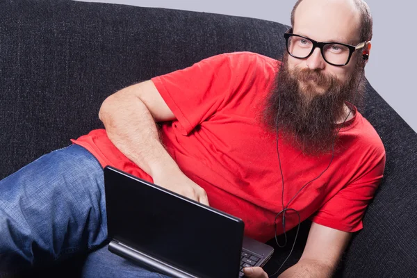 A man on the sofa is resting and enjoying - (Series) — Stock Photo, Image