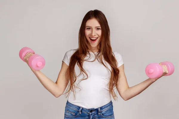 Portrait Excited Woman Standing Raised Arms Holding Pink Dumbbells Active — Stock Photo, Image