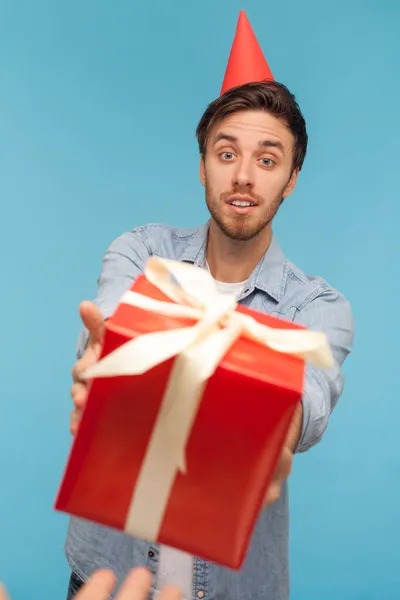 Pov Hand Giving Wrapped Red Gift Box Bearded Man Party — стоковое фото