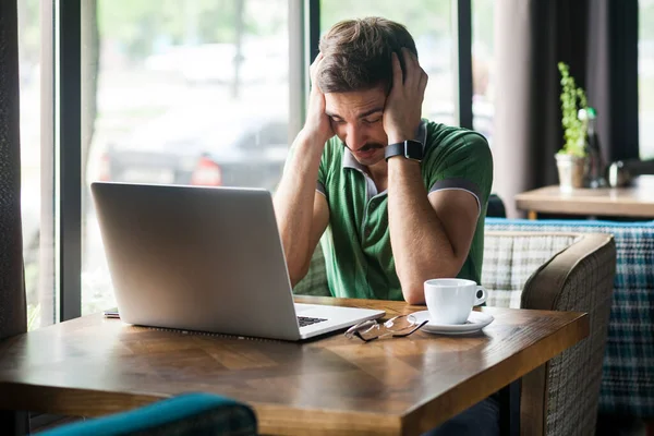 Portrait Exhausted Tired Man Freelancer Wearing Green Shirt Suffering Migraine — Stock Photo, Image