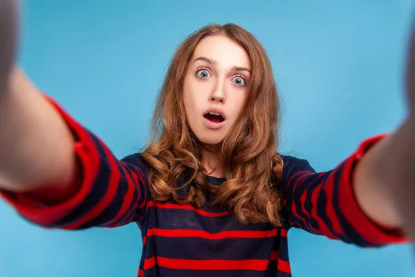 Surprised Woman Wearing Striped Casual Style Sweater Taking Selfie Shocked — стоковое фото