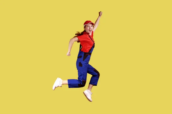 Side View Portrait Extremely Happy Worker Woman Jumping Clenched Fists — Stock Photo, Image