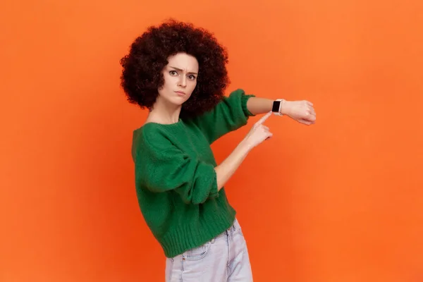 Bossy Woman Afro Hairstyle Wearing Green Casual Style Sweater Pointing — стокове фото