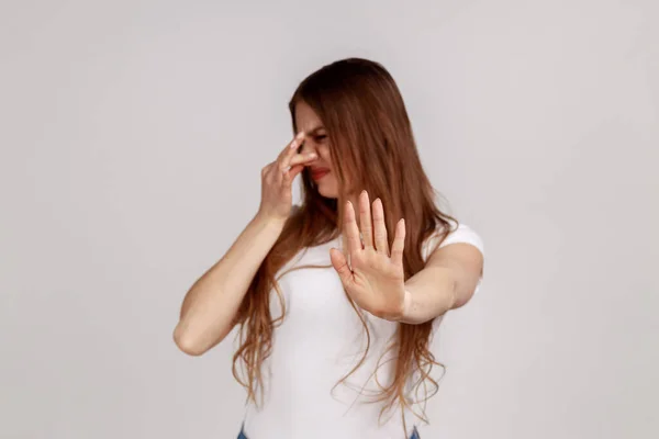 Displeased Woman Grimacing Disgust Holding Breath Pinching Nose Fingers Avoid — Stockfoto