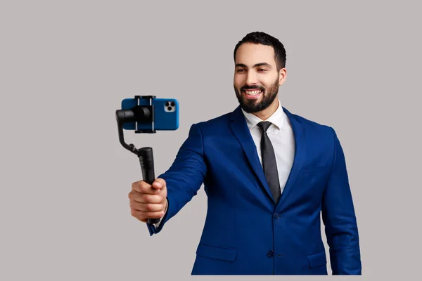 Attractive Young Adult Bearded Man Blogger Holding Steadicam Phone Making — Stockfoto