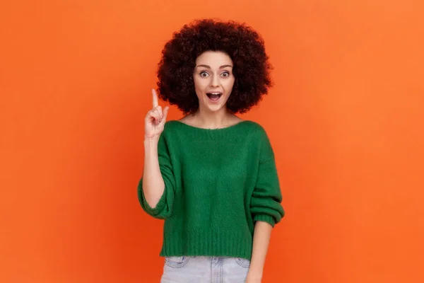 Happy Surprised Woman Afro Hairstyle Wearing Green Casual Sweater Raising — Stockfoto