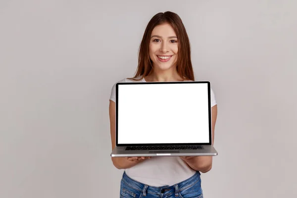Portrait Attractive Smiling Woman Holds Laptop White Display Internet Advertising — Zdjęcie stockowe