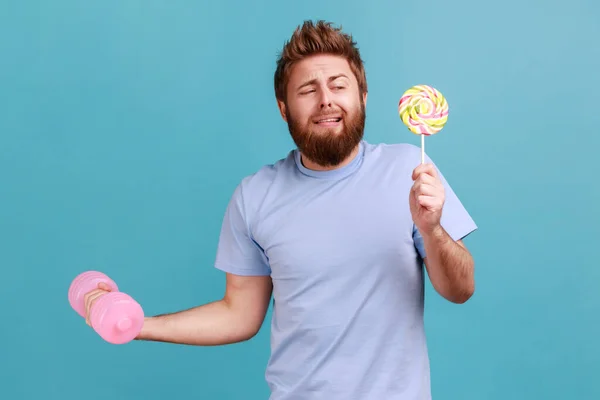 Portrait Funny Handsome Bearded Man Holding Delicious Lollypop Raised Hand — 图库照片