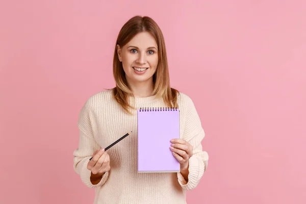 Portrait Happy Satisfied Blond Woman Pointing Paper Notebook Looking Smiling — Fotografia de Stock