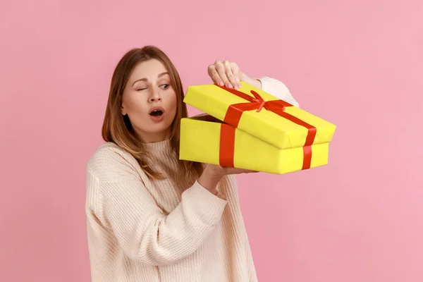 Portrait Curious Attractive Young Blond Woman Looking Yellow Present Box — 图库照片