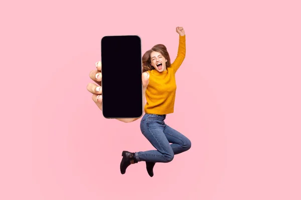 Happy Young Woman Flying Jumping Air Showing Big Mobile Empty — 图库照片