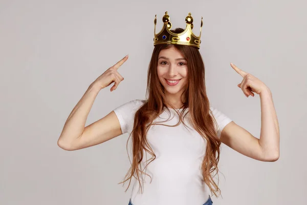 Happy Cheerful Woman Pointing Fingers Golden Crown Her Head Showing — Stockfoto