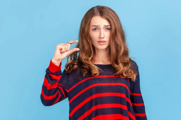 Too Small Portrait Dissatisfied Woman Striped Casual Sweater Showing Little — Stockfoto