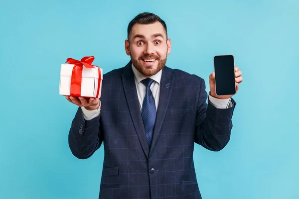 Happy Bearded Man Wearing Official Style Suit Holding Present Box — Stok fotoğraf
