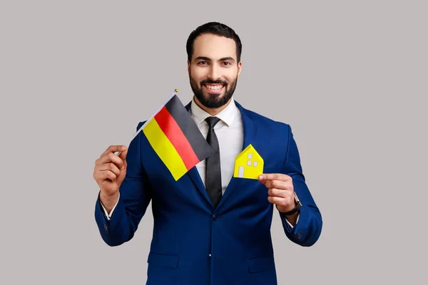 Satisfied Man Holding German Flag Paper House Dreaming Buy His — стоковое фото