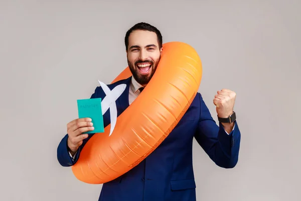 Happy Bearded Businessman Holding Orange Rubber Ring Paper Plane Passport — Stok fotoğraf