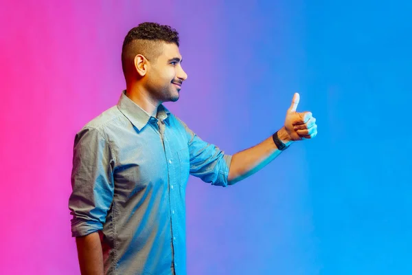 Side View Portrait Smiling Man Shirt Showing Thumb Gesture Looking — Stock Photo, Image