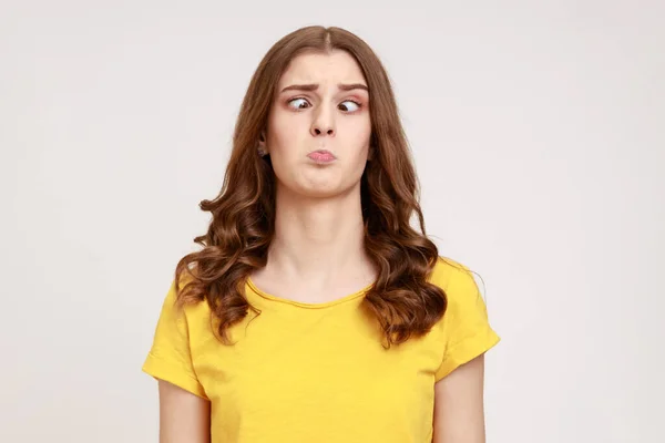 Portrait Attractive Funny Silly Young Woman Yellow Shirt Cross Eyed - Stock-foto