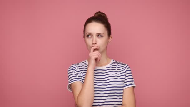 Pensive Young Adult Woman Holding Her Chin Seriously Thinking Problem — Stock Video