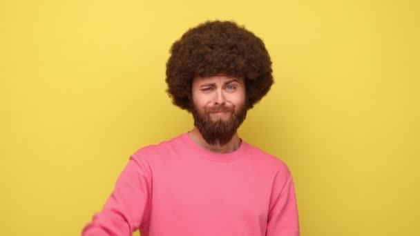 Bearded Unhappy Man Afro Hairstyle Showing Thumbs Dislike Gesture Negative — Stock Video