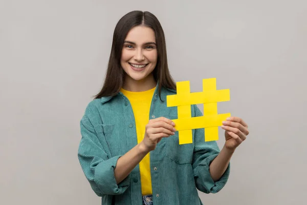 Portrait Happy Beautiful Woman Holding Hashtag Symbol Promoting Viral Topic — Stock Photo, Image