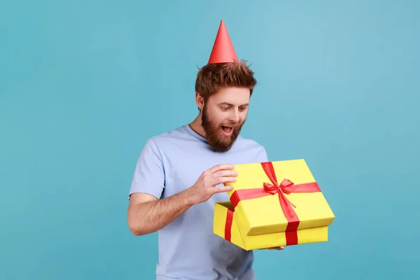 Man Party Cone Hat Holding Opened Gift Box Looking Currently — Φωτογραφία Αρχείου