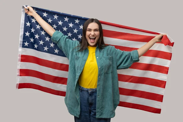 Happy Positive Woman Dark Hair Standing Raised Arms Holding Usa — стокове фото