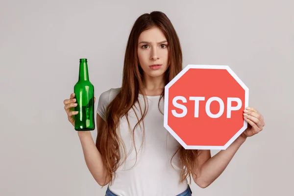 Portrait Anxious Beautiful Woman Showing Alcoholic Beverage Beer Bottle Stop — 스톡 사진