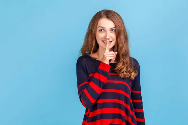Portrait Woman Wearing Striped Casual Style Sweater Keeping Finger Lips — стоковое фото