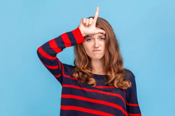 Unhappy Depressed Woman Wearing Striped Casual Style Sweater Showing Loser — Stock Photo, Image