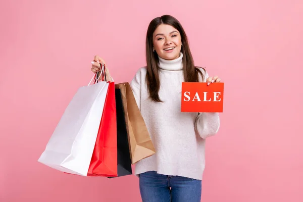 Satisfied Female Dark Hair Holding Sale Card Shopping Bags Huge — Stok fotoğraf