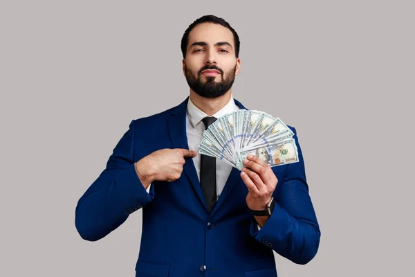 Portrait Rich Self Confident Bearded Businessman Holding Dollars Bills Pointing —  Fotos de Stock