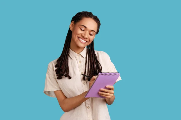 Portrait Happy Inspired Woman Dreadlocks Smiling Writing Interesting Idea Notebook — Zdjęcie stockowe