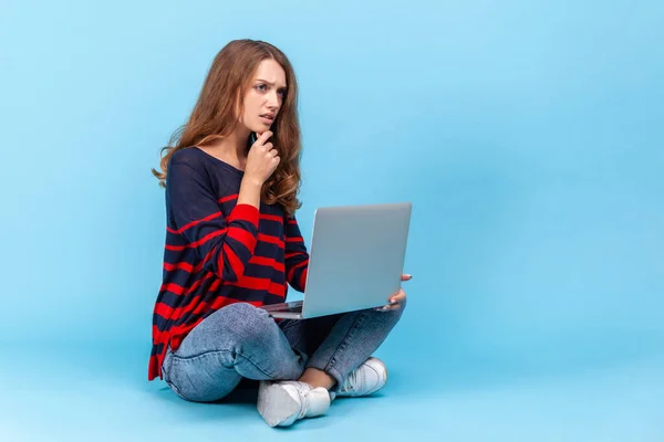 Thoughtful Woman Wearing Striped Casual Style Sweater Sitting Crossed Legs — Fotografia de Stock