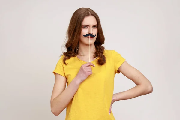 Portrait Funny Childish Teenager Girl Yellow Shirt Holding Fake Mustache — Stockfoto