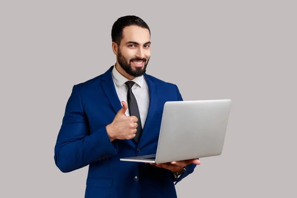 Portrait Optimistic Bearded Man Holding Laptop Looking Camera Showing Thumb — Photo