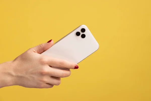 Closeup Profile Portrait Woman Hand Holding Mobile Phone Showing Back — Fotografia de Stock