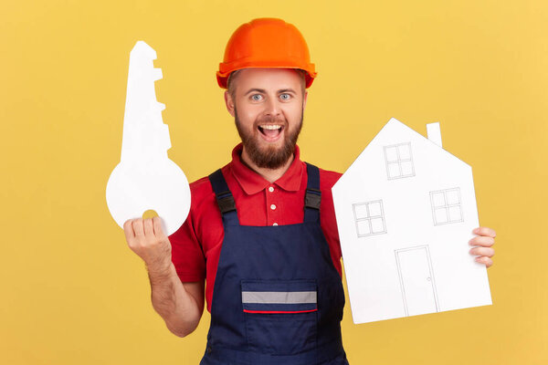 Portrait Smiling Builder Man Holding Paper House Key Looking Camera Stock Photo