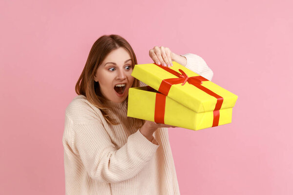 Portrait Excited Young Adult Blond Woman Looking Yellow Present Box Stock Picture