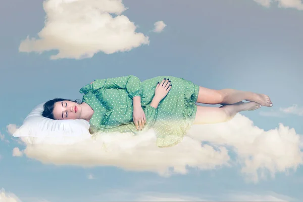 Sleeping beauty hovering in air. Relaxed girl in vintage ruffle dress lying comfortably on pillow levitating, keeping eyes closed watching dreams in the sky. collage composition on day cloudy blue sky