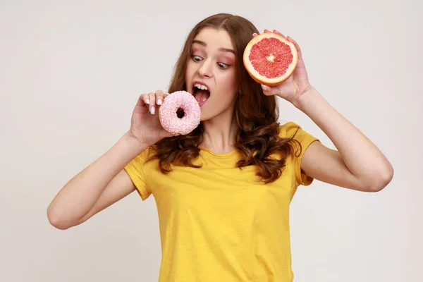 Hungry Teenager Girl Yellow Shirt Biting Sweet Junk Donut Instead — Stock Photo, Image