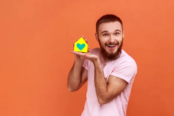 Portrait Bearded Man Holding Hands Showing Paper Model House His — Stock Photo, Image