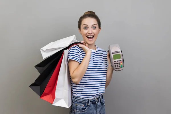 Portrait Smiling Cheerful Woman Wearing Striped Shirt Holding Showing Payment — Stockfoto