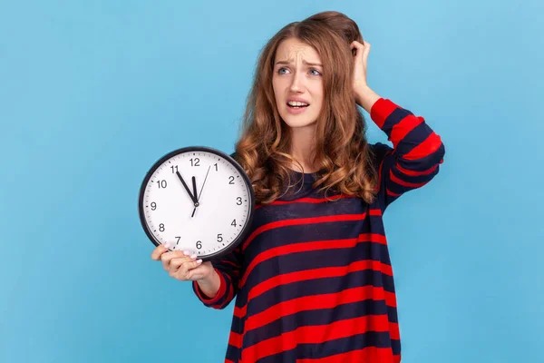 Nervous Woman Wearing Striped Casual Style Sweater Anxiously Looking Aside — Stockfoto