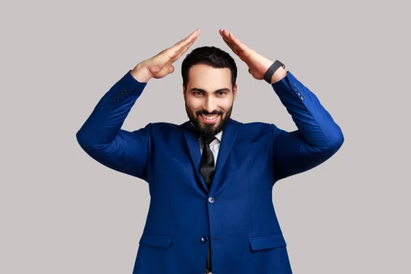 Smiling Bearded Man Standing Raising Hands Showing Roof Gesture Smiling — 图库照片