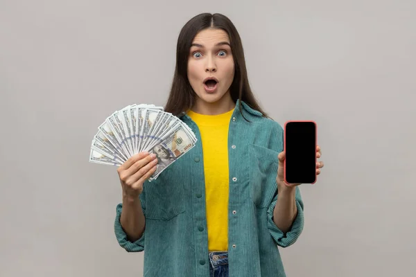Shocked Amazed Woman Holding Hands Smart Phone Blank Screen Dollars — Zdjęcie stockowe