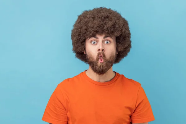 Portrait Silly Man Afro Hairstyle Orange Shirt Puckers Lips Makes — Stock Photo, Image